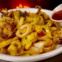 Calamari · Dredged in seasoned flour, flash fried and tossed with casino butter, pepper rings, roasted ...