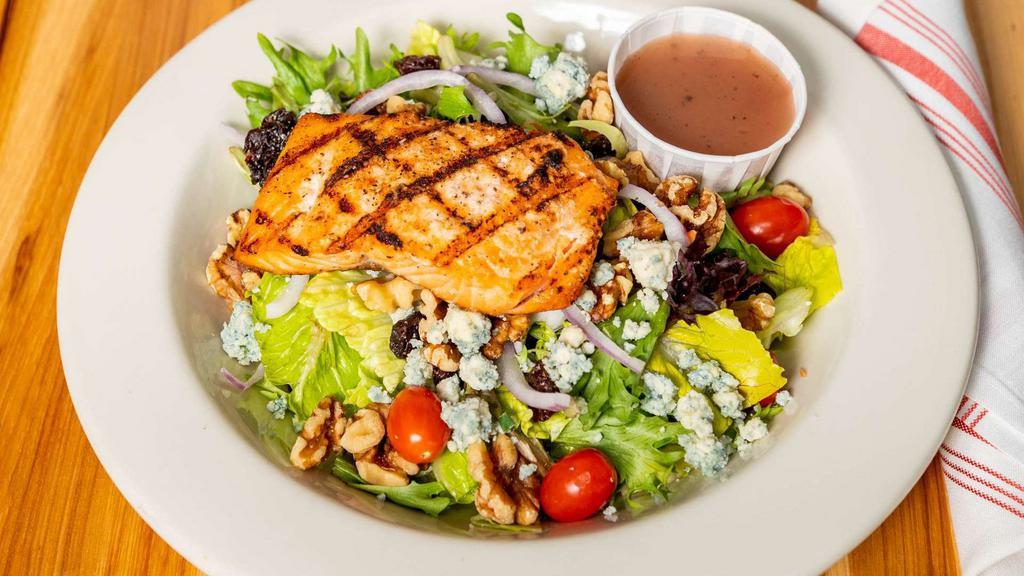 Michigan Salmon Salad · Fresh greens topped with grilled salmon, bleu cheese crumbles, walnuts, dried cherries red onion and grape tomatoes.