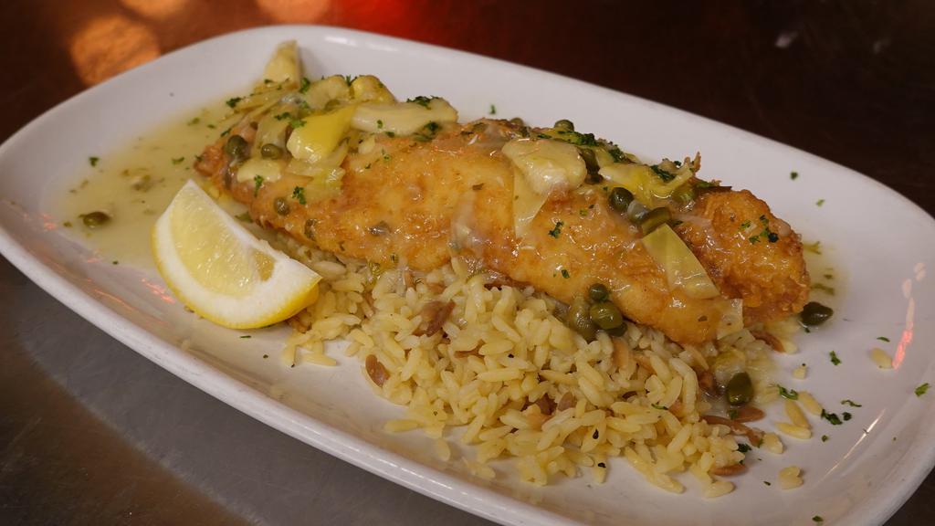 Grouper Piccata · Lightly dusted tender Grouper with a lemon butter, caper and artichoke sauce, over rice pilaf.