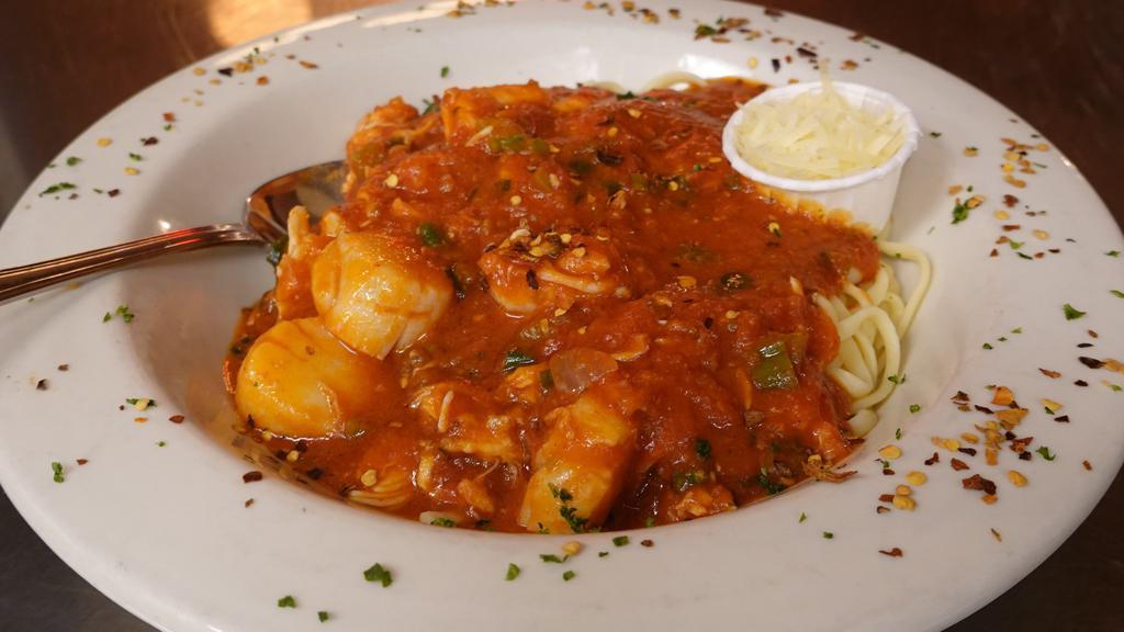 Seafood Diablo · Shrimp, scallops and crab tossed in a spicy rich tomato sauce served over linguini.
