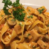 Primavera · Fettuccine pasta with assorted vegetables in cream sauce.