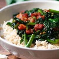 Greens  W/ Rice · This child hood dish taste amazing. Sometimes, less is MORE. Meal includes 2 egg rolls and s...