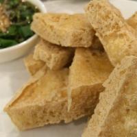 Fried Tofu · 12 pieces. Deep fried tofu, served with our house plum sauce, crushed peanuts, chili sauce a...