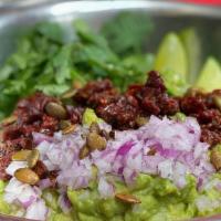 Amici'S Guac · Avocados mixed with fresh lime juice and salt. Topped with cilantro, red pepper, fresh serra...