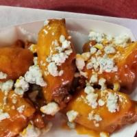 Buffalo Wings · Our take on a classic sauce. Topped with Gorgonzola.