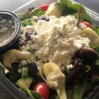 Mediterranean Salad · Mixed greens, cherrytomatoes, cucumber, artichokes, kalamata olives and feta cheese served w...