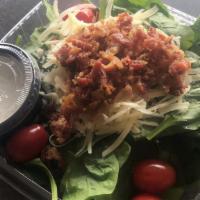 Spinach Salad · Fresh spinach, grape tomatoes, bacon and Parmesan, served with our garlic-romano dressing on...