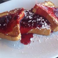 Strawberry French Toast · Three thick slices, dipped in egg batter covered with strawberry topping and whipped cream, ...