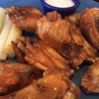 Chicken Wings · Buffalo or BBQ wings served with blue cheese or ranch dressing.