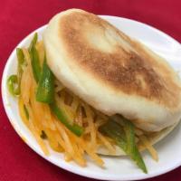 Strip Potato Sandwich With Hot & Sour Sauces 酸辣土豆丝夹大饼 · Spicy.