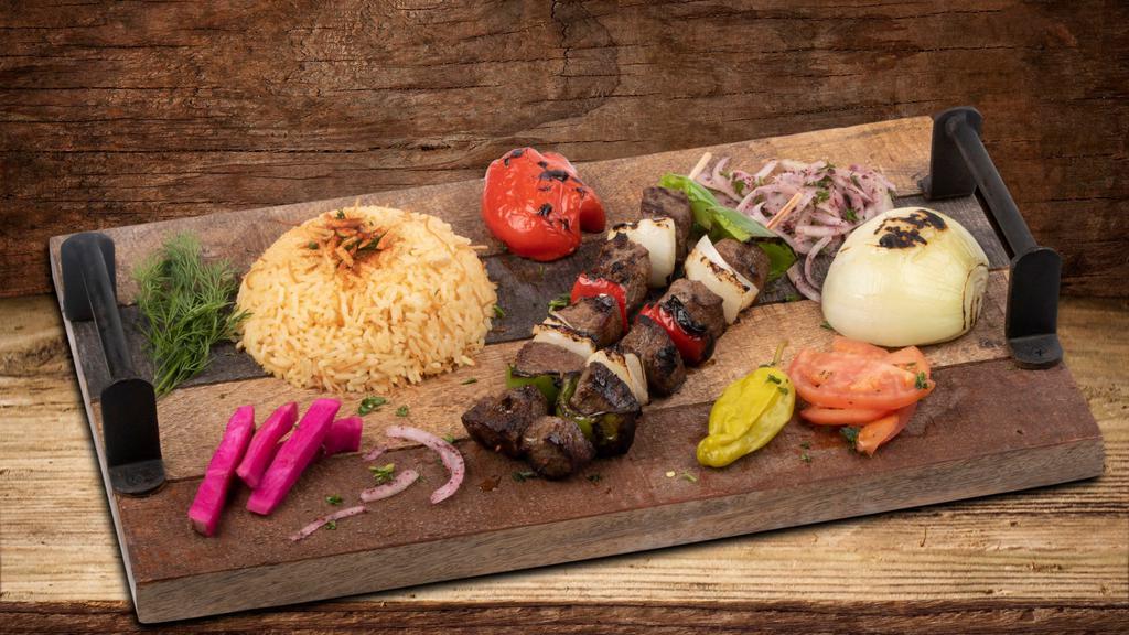 Shish Kabob · Marinated chunks of beef tenderloin, served with grilled onions.