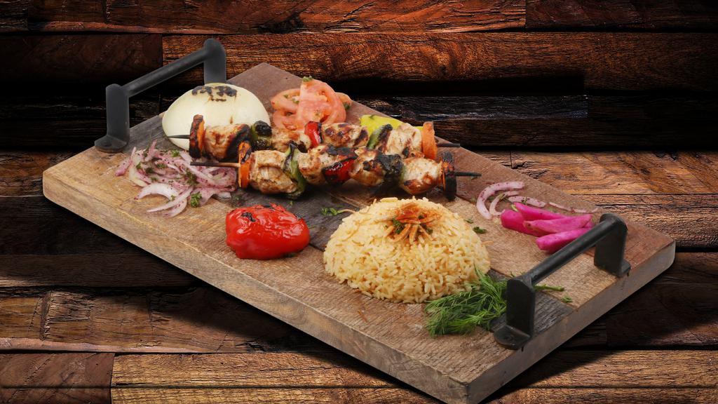 Shish Tawook · Marinated chunks of chicken breast with our special spices, served with grilled pepper.