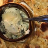 Spinach Artichoke Dip · With herbed flatbread.