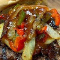 Smokestack Burger · 1/2 lb house-ground beef chuck topped with pulled pork ribs, smoked gouda, sauteed onion and...