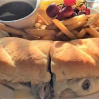 French Dip · 1/2 lb roasted beef, swiss cheese, on a hoagie roll with au jus.