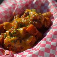 Loaded Tots · Tator Tots, Chili, Cheese Blend, and Chives. Served w/ Sour Cream.
