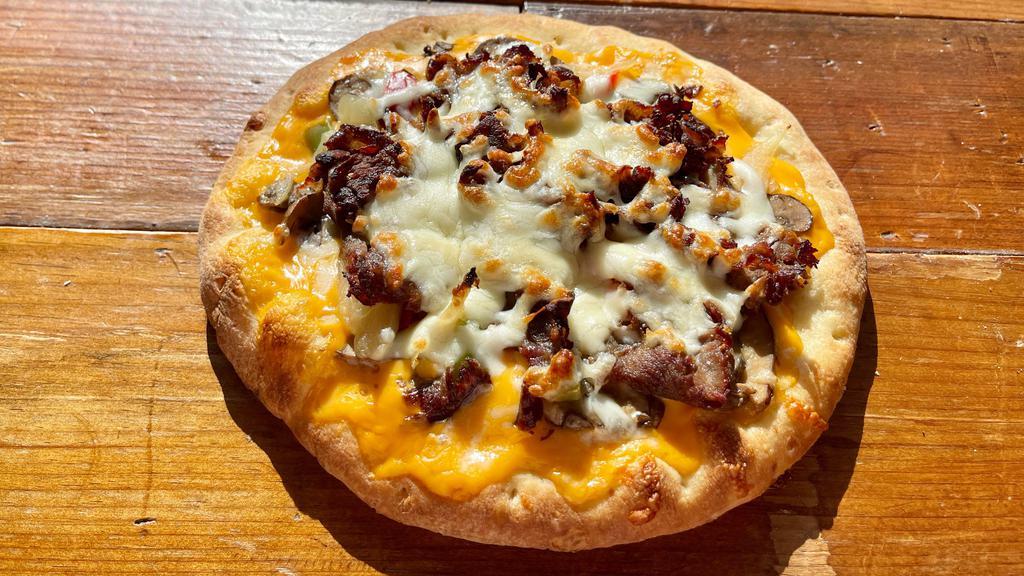 Cheesesteak · Griddled Steak, Sautéed Onions, Sweet Pepper Strips, and Mushrooms over a Cheese Wiz Base Topped with Melted Mozzarella, Provolone, and Muenster Cheeses.