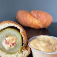 Cajun Dill Dough · Cored Dill pickle stuffed with Pimento cheese and rolled in a Cajun spiced dough then fried ...