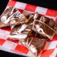 S’Mores Bark · Rich Milk Chocolate set and broken into pieces with Mini Marshmallow and Graham Cracker Crum...