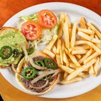 Mexican Burger · A spicy twist on the boring burger! Grilled fresh hamburger topped with sautéed onions, jala...