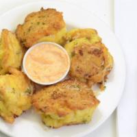 Nonna'S Cauliflower Tosca · Egg and Romano cheese battered cauliflower, sauteed in olive oil and served with garlic Sauce.