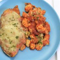 Chicken Parmesan & Gnocchi Marinara · Hand breaded, sauteed breast of chicken topped with provolone and parmesan cheese. Served wi...