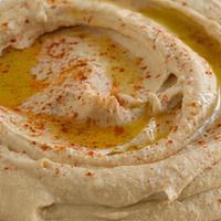 Hummus Appetizer · Chick-peas pureed with Tahini sauce, lemon-juice and a hint of fresh garlic. Add a little ol...