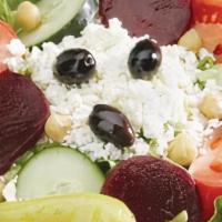 Greek Salad · With lettuce, tomato, cucumber slices, pepperoncini, Greek olives, beets, chickpeas, feta ch...