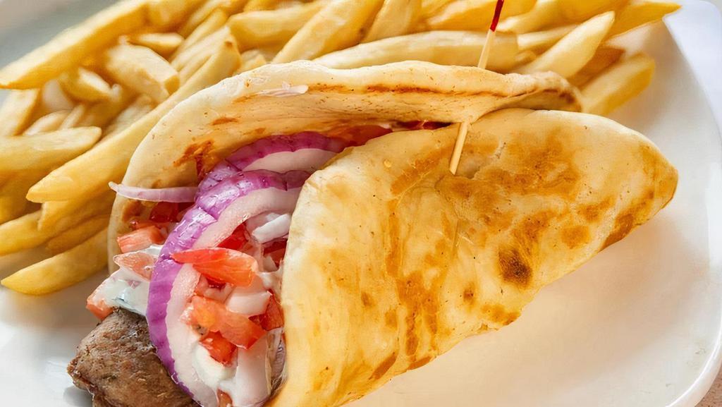 Gyro Sandwich · Gyro meat, tzadziki sauce, tomato and onion wrapped in a grilled pita.