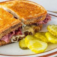 Corned Beef Sandwich · Sliced corned beef and Swiss cheese on grilled rye.