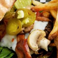 The Mushroom Swiss Burger · 1/2 lb. patty topped with portabella mushroom cap, Swiss cheese, lettuce, tomato and onions.