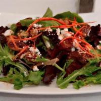 Fig And Goat Cheese Salad · mixed greens topped with goat cheese, organic unsweetened dried figs, walnuts, pomegranate d...