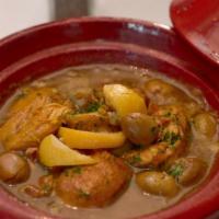 Moroccan Chicken · Half Amish chicken braised with saffron, olives and preserved lemons. Gluten free