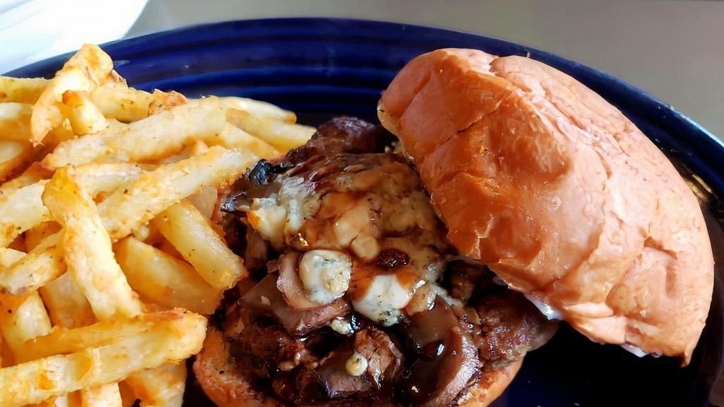 Wild Bleu Yonder Burger · Topped with roasted mushrooms, melted bleu cheese, black truffle mayo and cabernet-balsamic reduction.