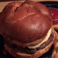 Kentucky Beer Cheese Burger · Bacon crusted burger topped with fried egg, beer battered onion ring, beer cheese fondue, an...