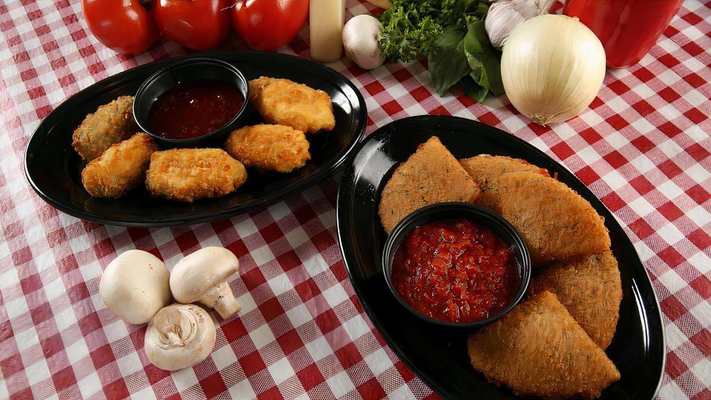Fried Mozzarella · Lightly seasoned and breaded wedges, made from fresh Mozzarella and fried until golden brown. Served with a side of our signature pasta sauce.