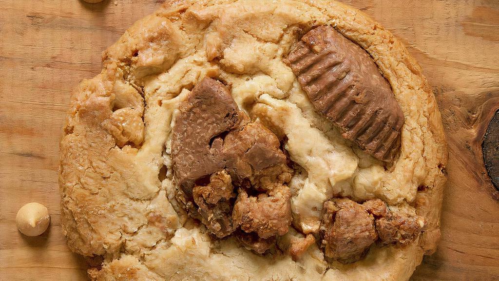 Reese'S Peanut Butter Cup Cookie · Peanut Butter lovers unite! Peanut Butter cookie dough is loaded with peanut butter chips and topped with chunks of Reese's Peanut Butter Cups