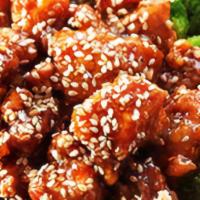 Sesame Chicken · includes side of white rice