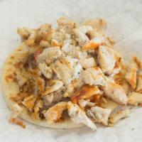 Chicken Pita · Chopped chicken breast served on a pita with onion, tomato and cucumber sauce.