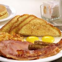 Lumberjack Slam® · Buttermilk pancakes, grilled ham, bacon strips, sausage links, eggs, hash browns and choice ...