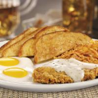 Country Fried Steak & Eggs · A chopped beef steak smothered in country gravy. Served with two eggs hash browns and choice...