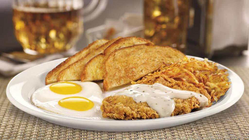 Large  Country Fried Steak & Eggs. · A chopped beef steak smothered in country gravy. Served with two eggs hash browns and choice of bread.