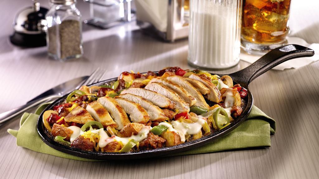 Crazy Spicy Sizzlin' Skillet · Chorizo sausage, fire-roasted bell peppers & onions, mushrooms, jalapeños and seasoned red-skinned potatoes. Topped with grilled seasoned chicken breast, Cheddar cheese, a spicy five pepper sauce and Pepper Jack queso.  .