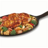 Bourbon Chicken Sizzlin' Skillet  · Grilled seasoned chicken breasts covered with a bourbon glaze atop seasoned red-skinned pota...