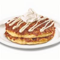 Stack Of Cinnamon Roll Pancakes  · Buttermilk pancakes cooked with cinnamon crumb topping and topped with whipped cream and cre...