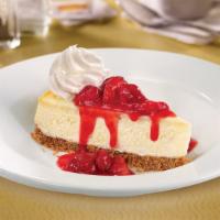New York Style Cheesecake · Delicious and smooth, topped with strawberries
