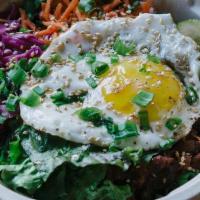 Bibimbap · rice served with vegetables and your choice of beef, spicy pork, or tofu with a sunny side u...