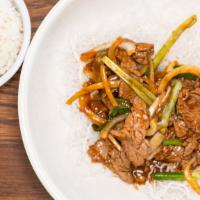 Mongolian Beef · Marinated sliced beef with saute scallions and onion.