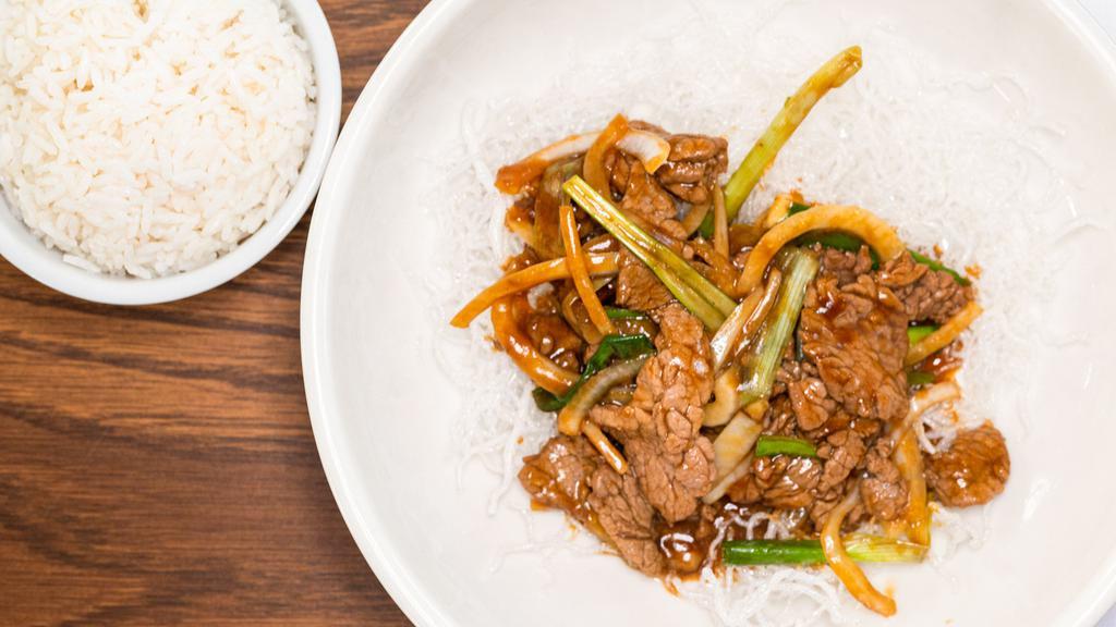 Mongolian Beef · Marinated sliced beef with saute scallions and onion.