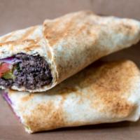 Beef Shawarma · Parsley, onions, pickles, tomatoes and tahini sauce.